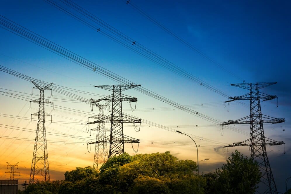Sun setting silhouette electricity pylons 1127 2986
